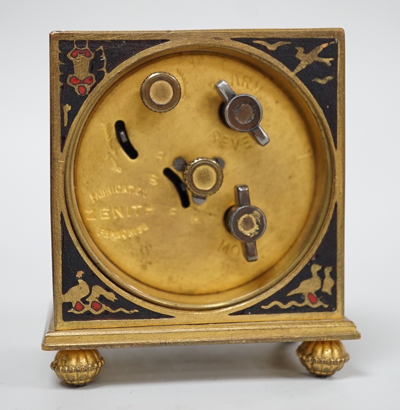 A Zenith champleve enamel Egyptianesque travelling alarm clock in case, 10cm total height